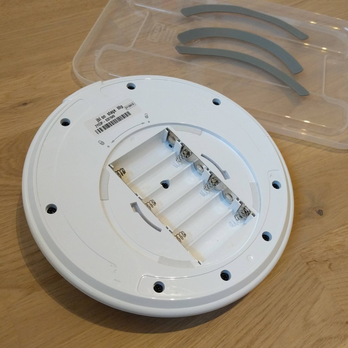 The rubber pads can be peeled off the speaker bottom. Remove all glue residues. The pads can be glued back on later.