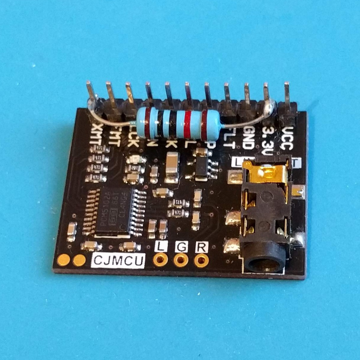 The CJMCU-5102 audio module needs a 10 kΩ resistor between XMT and 3.3V to unmute. I just soldered the biggest one I had directly on the board. The FLT, DMT, SCL and FMT pins are all connected to the GND pin on the backside.