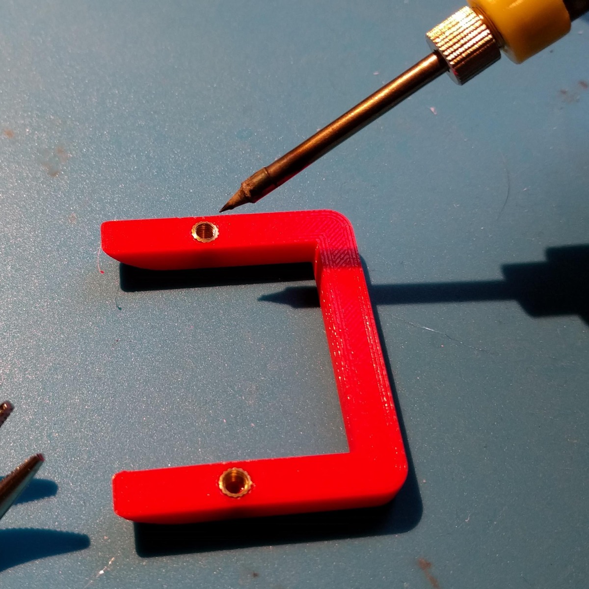 The printed curb after adding two threaded inserts with a soldering iron