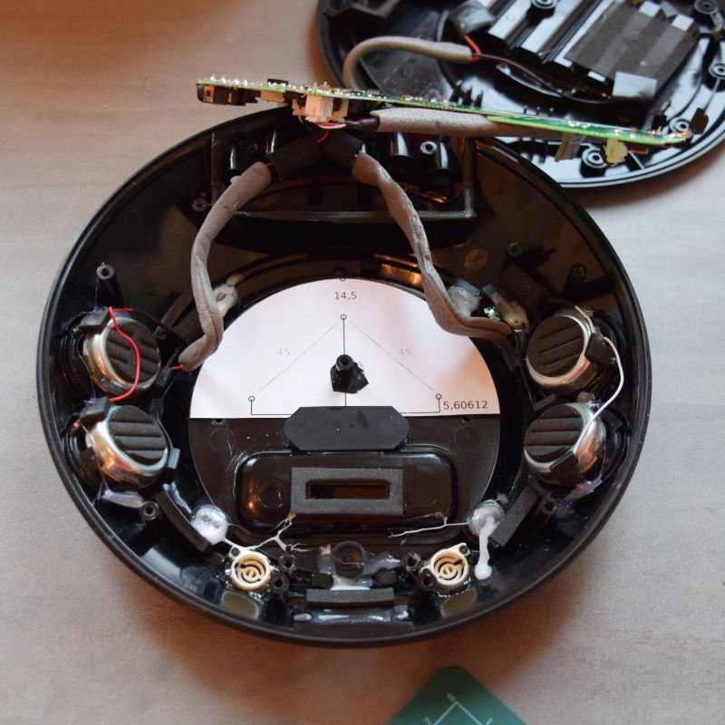 The opened speaker case with the drilling template